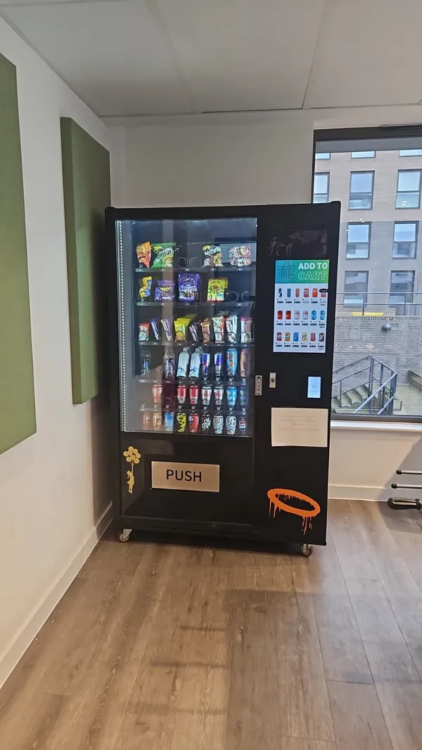 Snack and drink machine in a bright coworking space