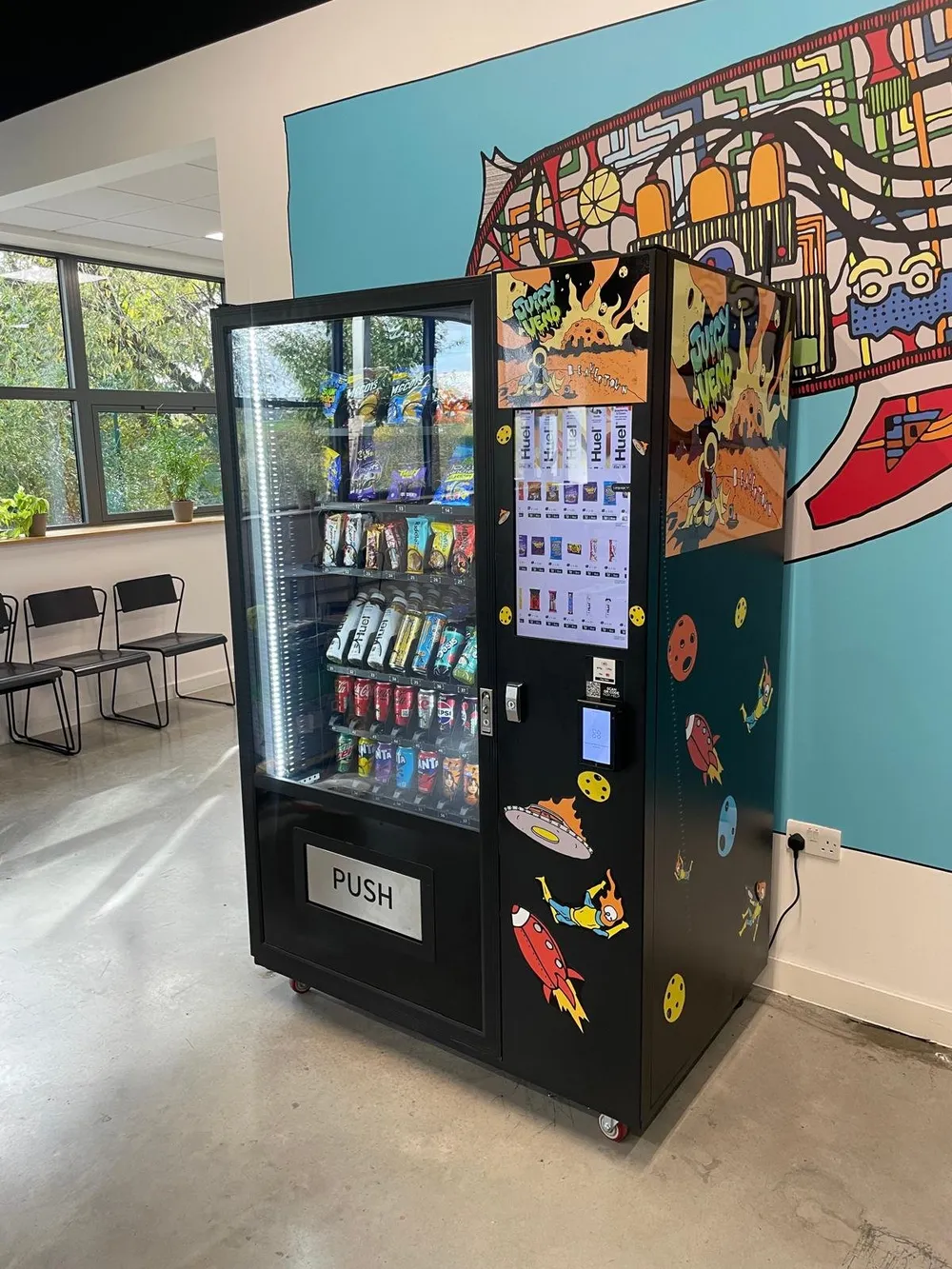 JV A11 with a colourful mural wrap in an office