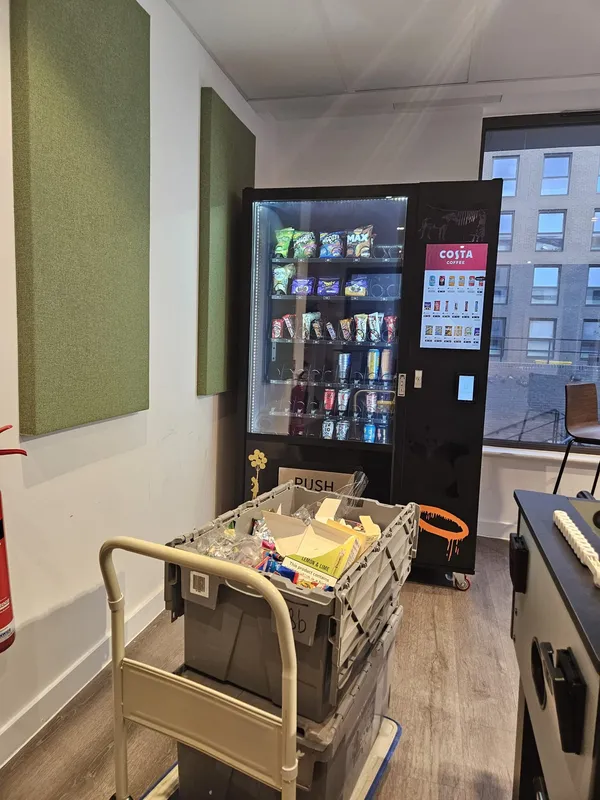 Restocking a snack and drink machine
