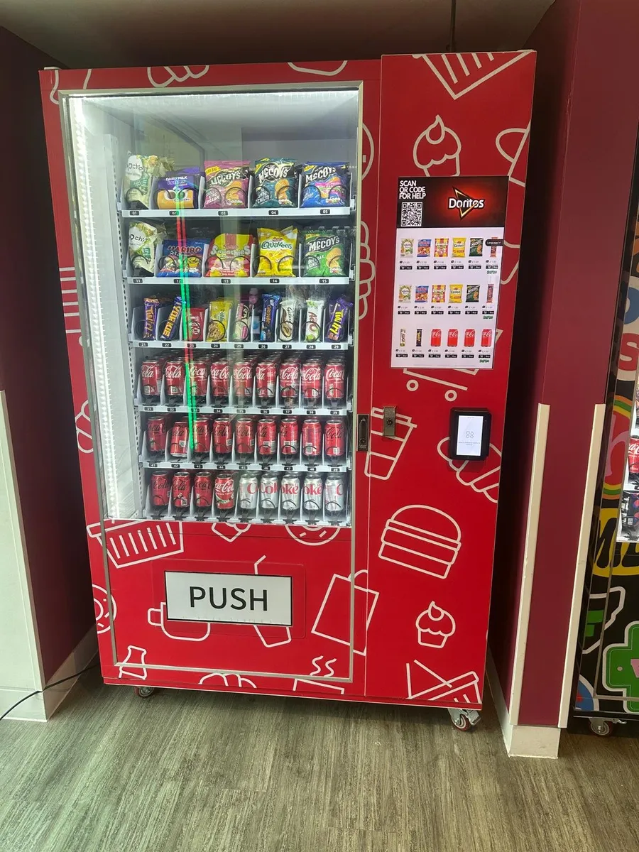 Red wrapped snack and drink machine in a residential building