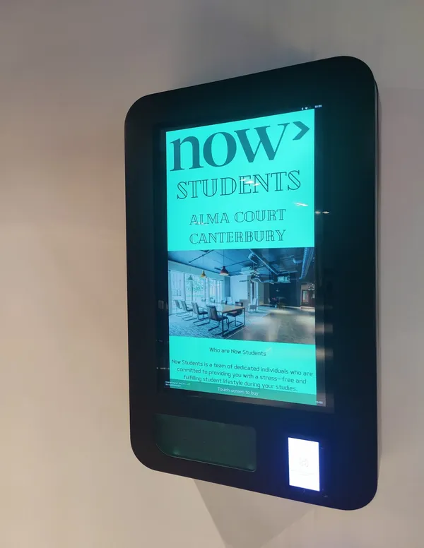Wall-mounted touchscreen vending unit in student accommodation